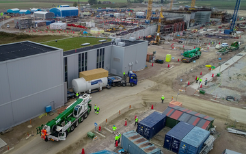 The Target Moderator Cryogenic Plant arrives on the back of a bed trailer at the giant building site of the ESS in Lund.